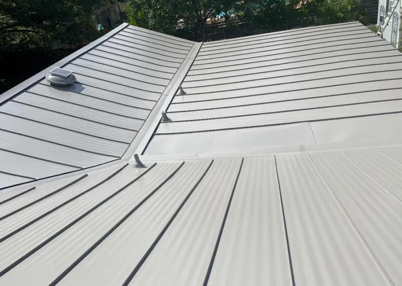 Solar attic fan installed on a metal roof for Roof Ventilation in Sammamish